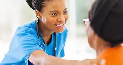 Care Worker Comforting Patient